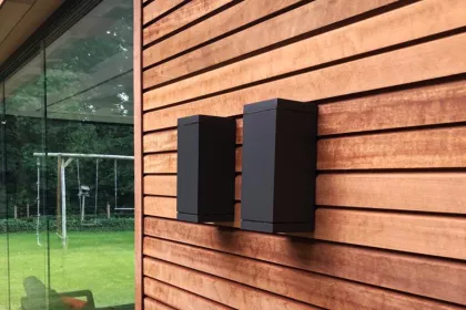 Bigger view of Antraciet grijze outdoor wandarmatuur. Strak en modern in combinatie met een houten gevel door E-T-S elektro